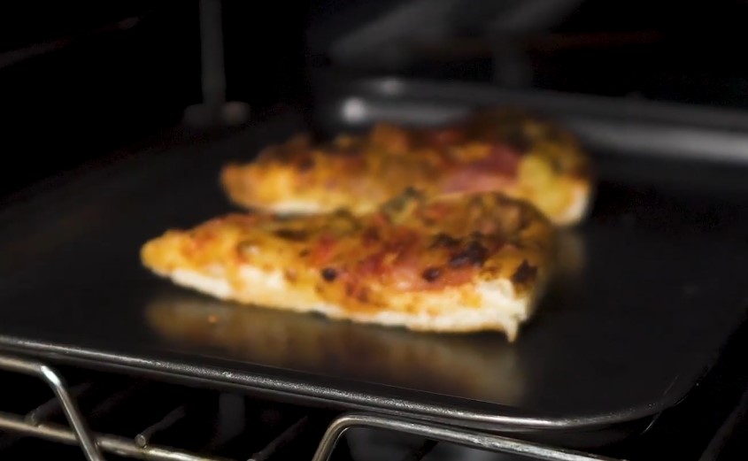 Leftover pizza slices in oven
