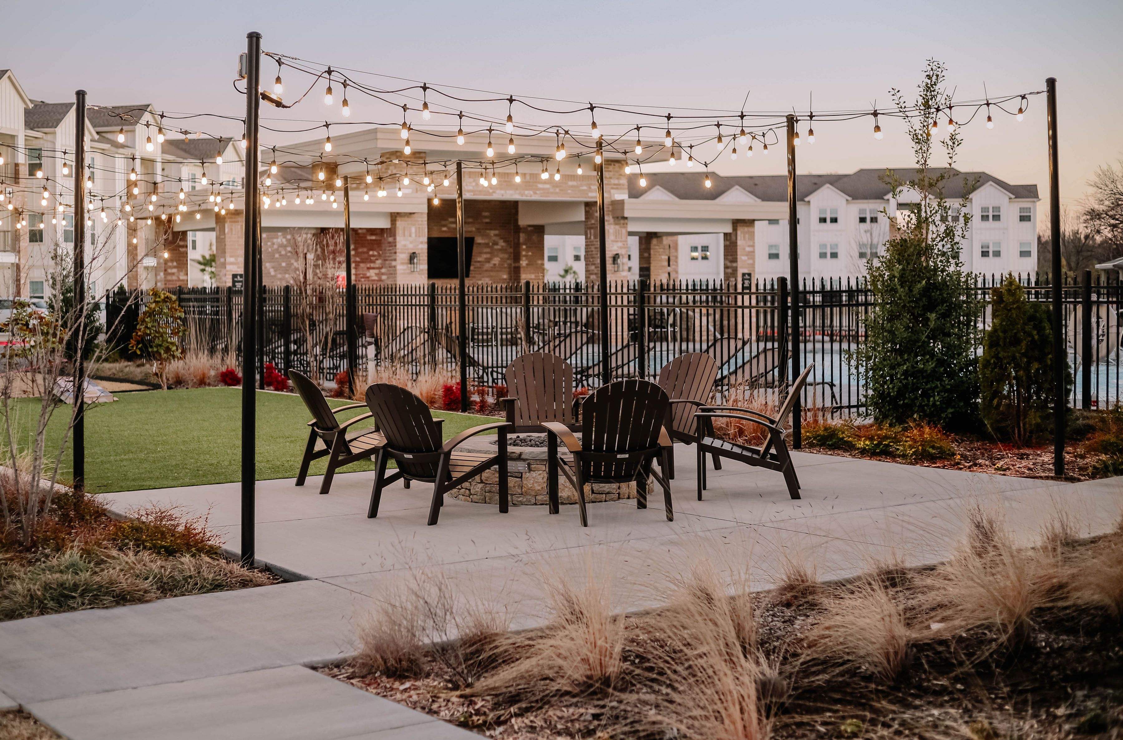 Elegant outdoor patio with string lights and chairs for evening gatherings